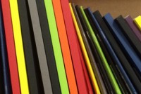 A4 folders on a shelf, stacked vertically