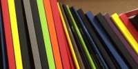 A4 folders on a shelf, stacked vertically
