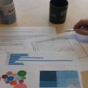 Reports on a desk with two coffee cups
