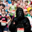 Scene from London Marathon showing runner in a Gorilla costume