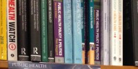Book shelf labelled Public Health, holding public health books.